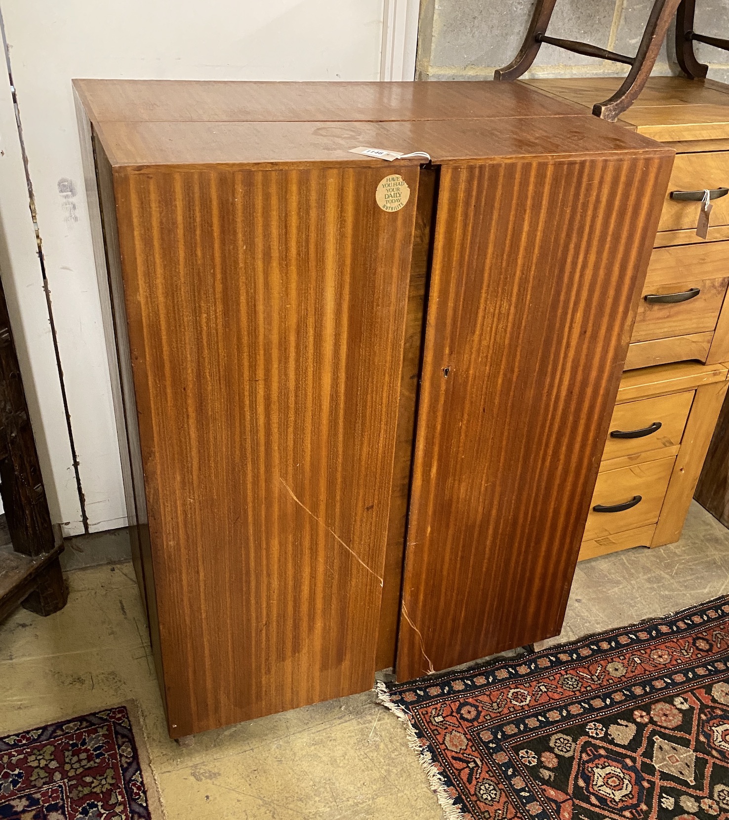 A mid century teak 'magic box' enclosed desk, width 85cm, depth 54cm, height 114cm